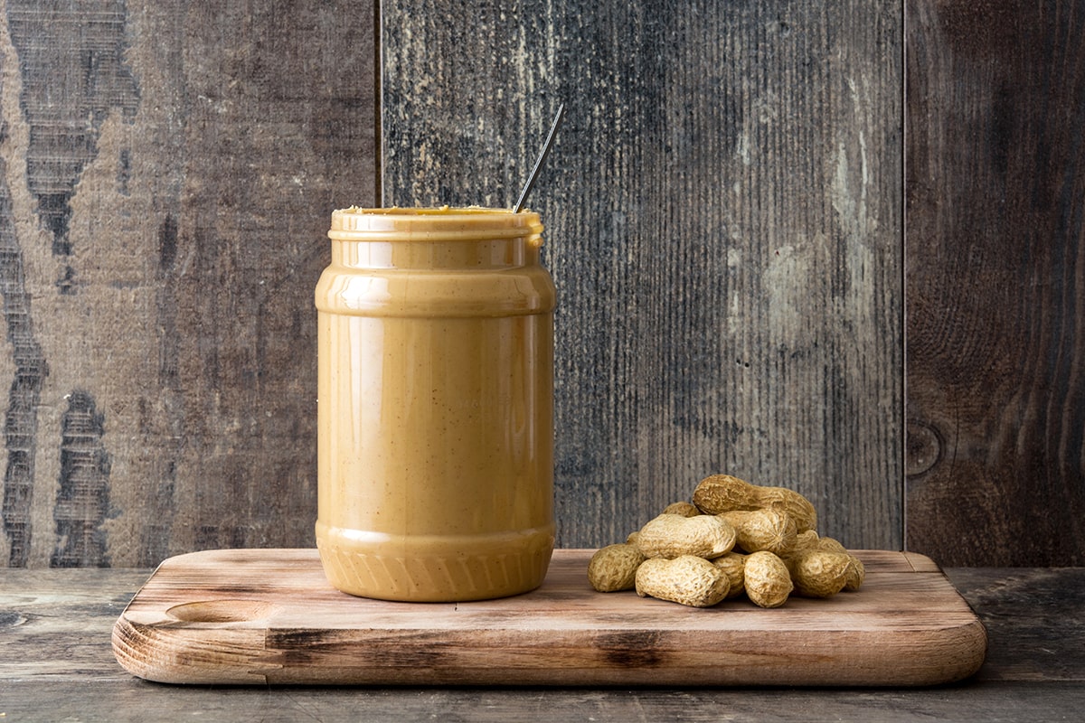 Peanut butter jar on wooden table