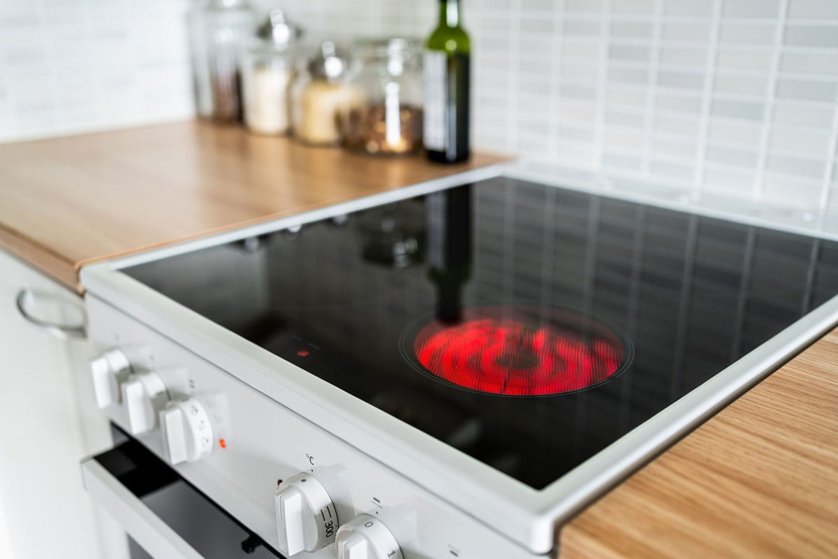 Stove and cooker red hot. Induction, ceramic cooktop, electric stovetop and hob in kitchen