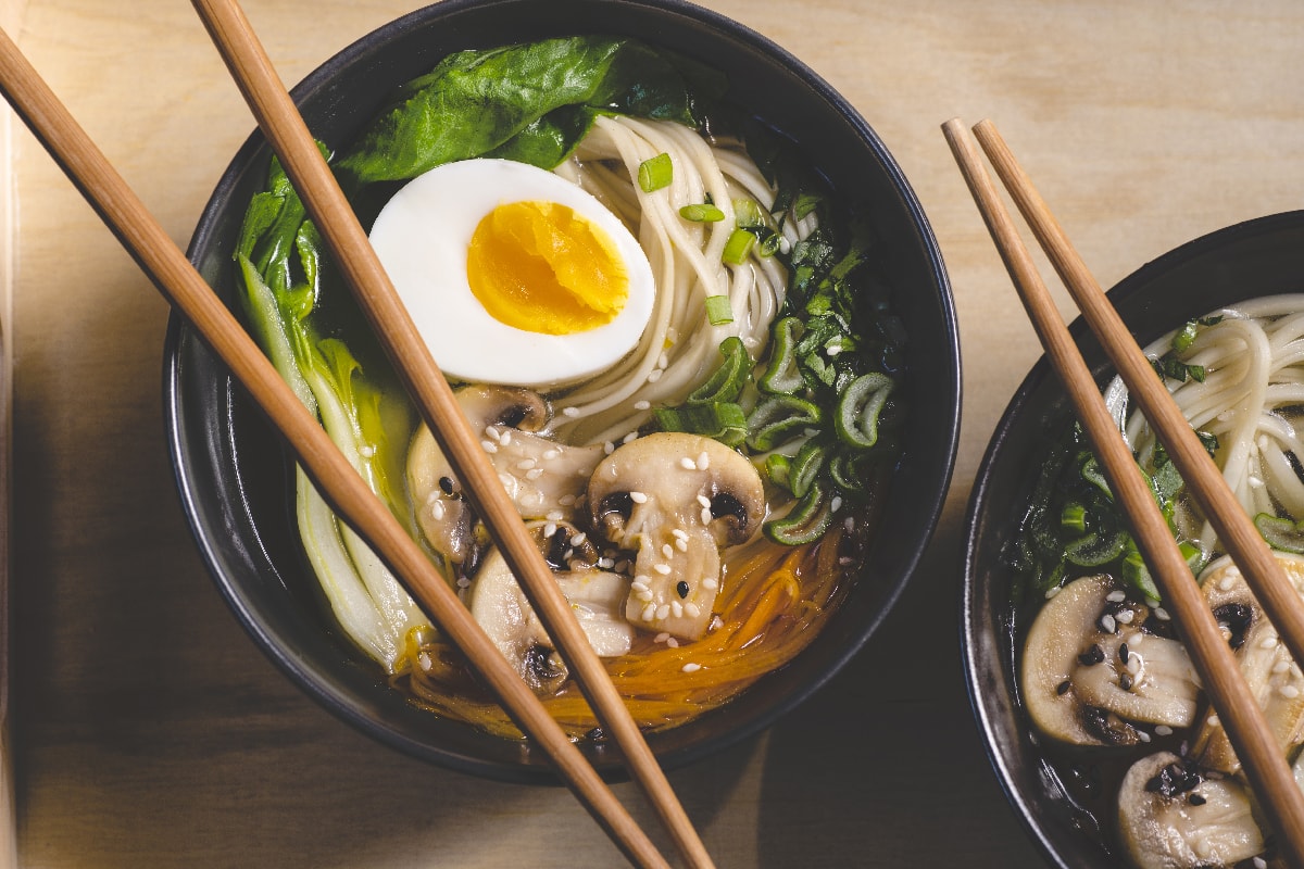 Traditional japanese ramen soup with mushrooms and bok choy