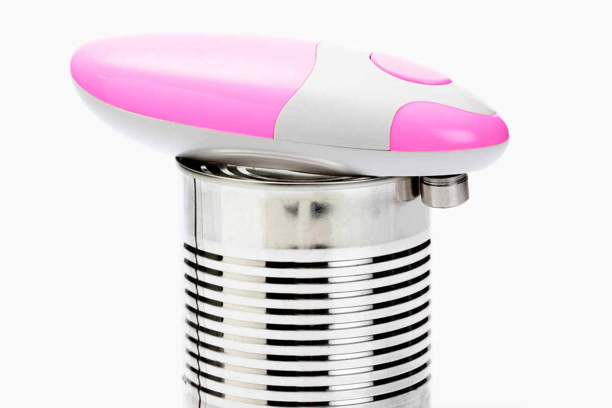 White pink color can tin opener on the top of the can ready to open