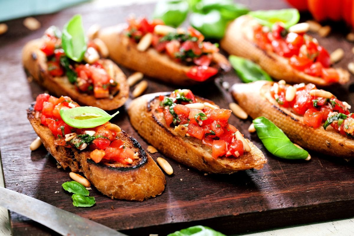 Bruschetta, on slices of toasted baguette garnished with basil