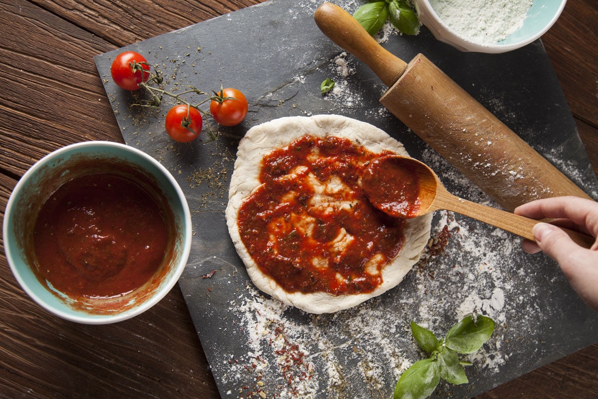fresh-tasty-homemade-pizza-preparation-homemade-tomato-sauce, Should You Cook Pizza Sauce?