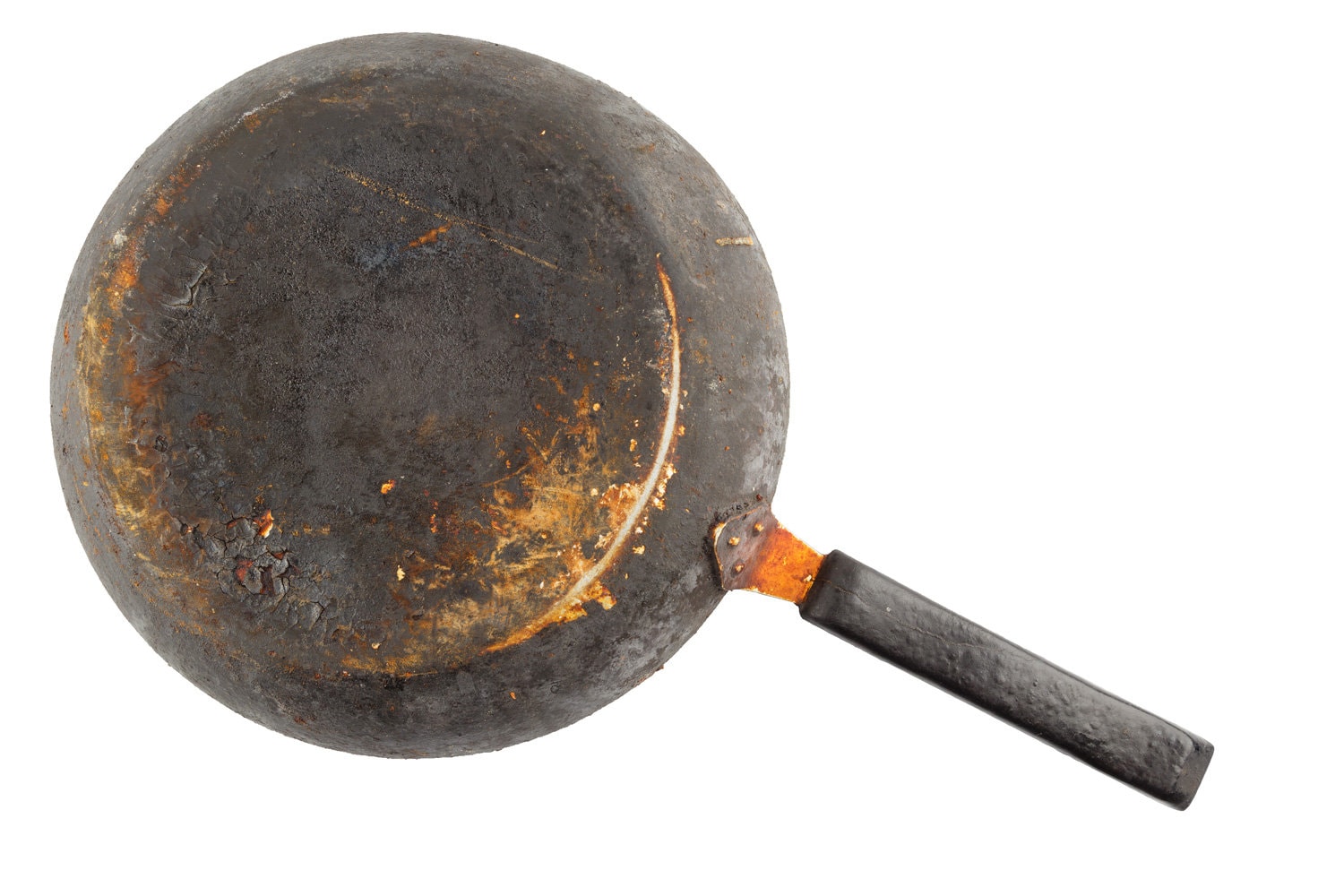 old stained rusty cast iron pan with burnt fat isolated on white bottom up in flat lay perspective