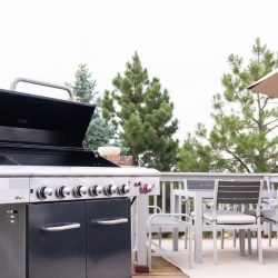 outdoor-sixburner-gas-grill-on-back front view on wood deck, Blackstone Griddle Igniter Keeps Clicking - Why And What To Do?