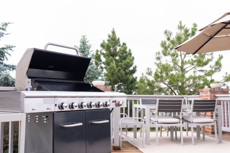outdoor-sixburner-gas-grill-on-back front view on wood deck, Blackstone Griddle Igniter Keeps Clicking - Why And What To Do?