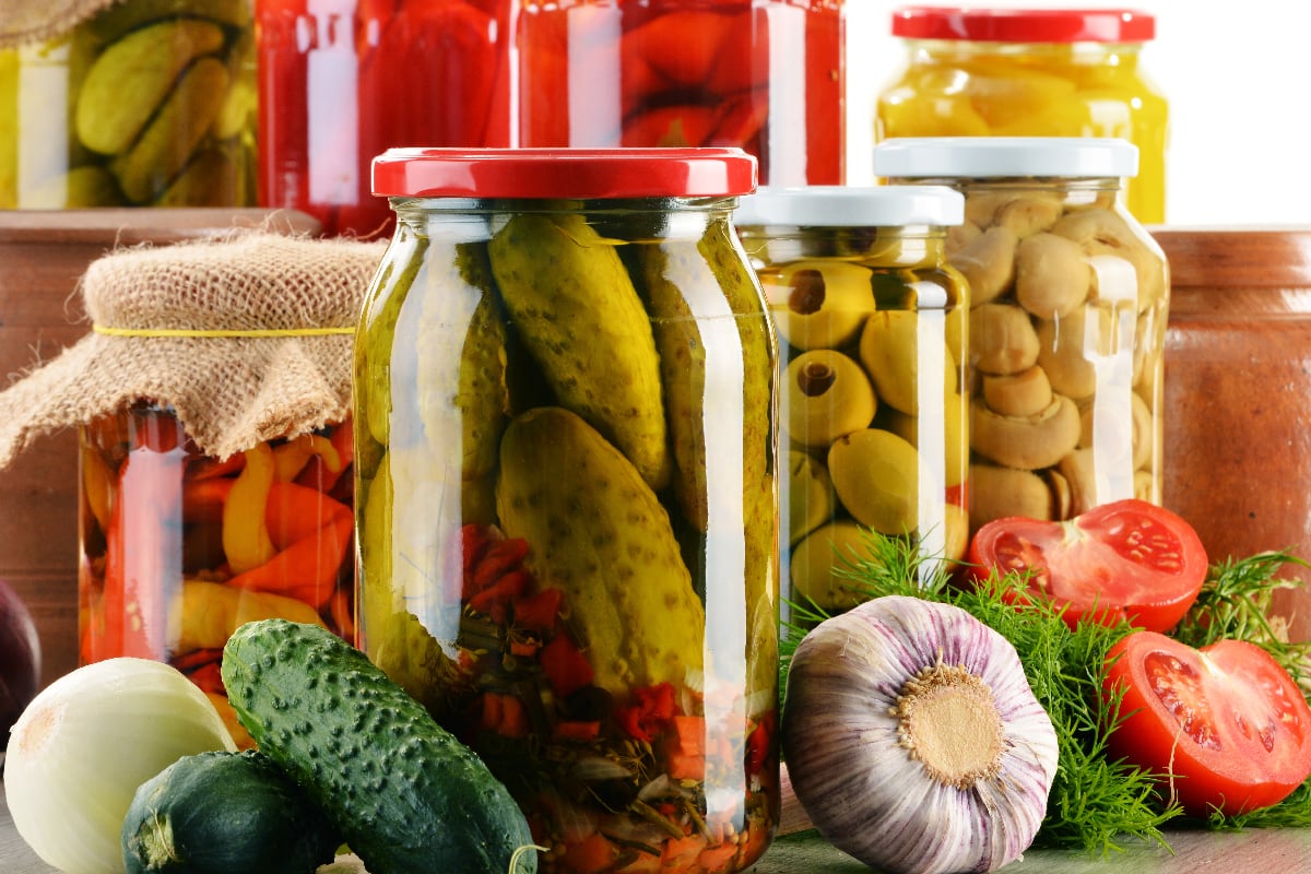 Composition with jars of pickled vegetables