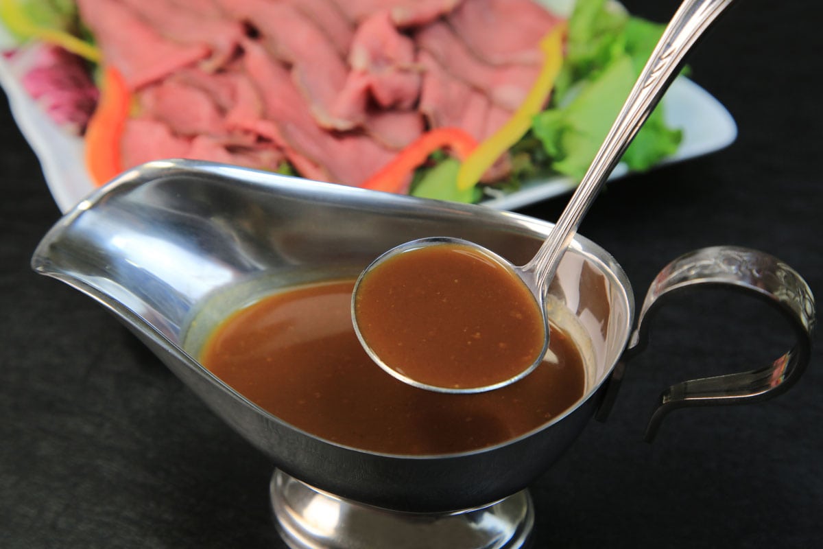 Gravy in serve with a serving spoon