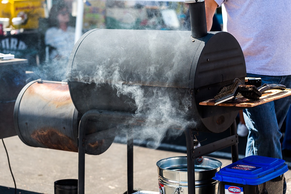 Large barbecue smoker cooking meat