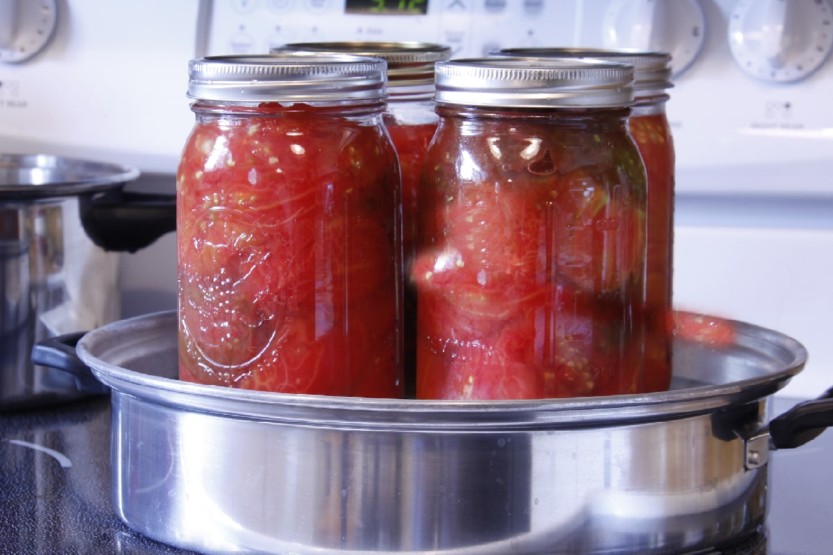These quarts of tomatoes are ready to be processed in a steam canner