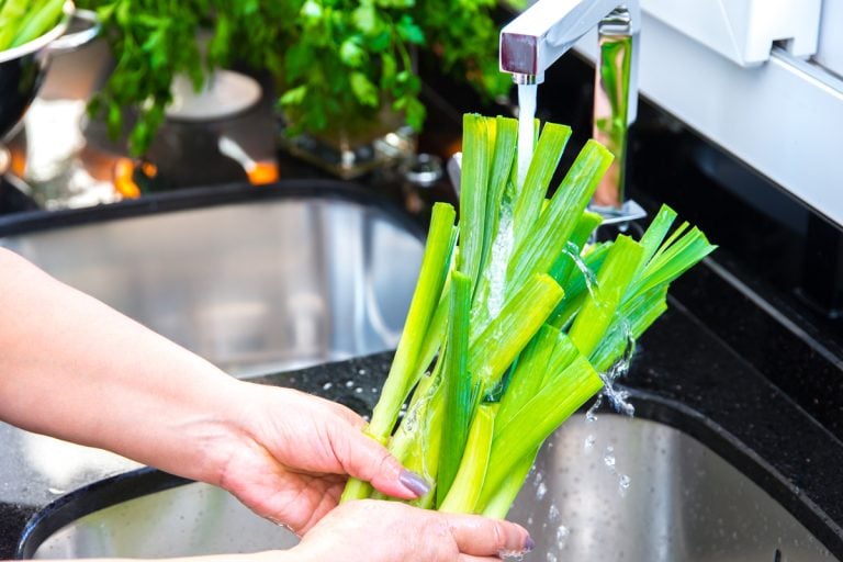 Washing leeks in the sink, How to Cook with Leeks [14 Great Recipes to Get You Started]