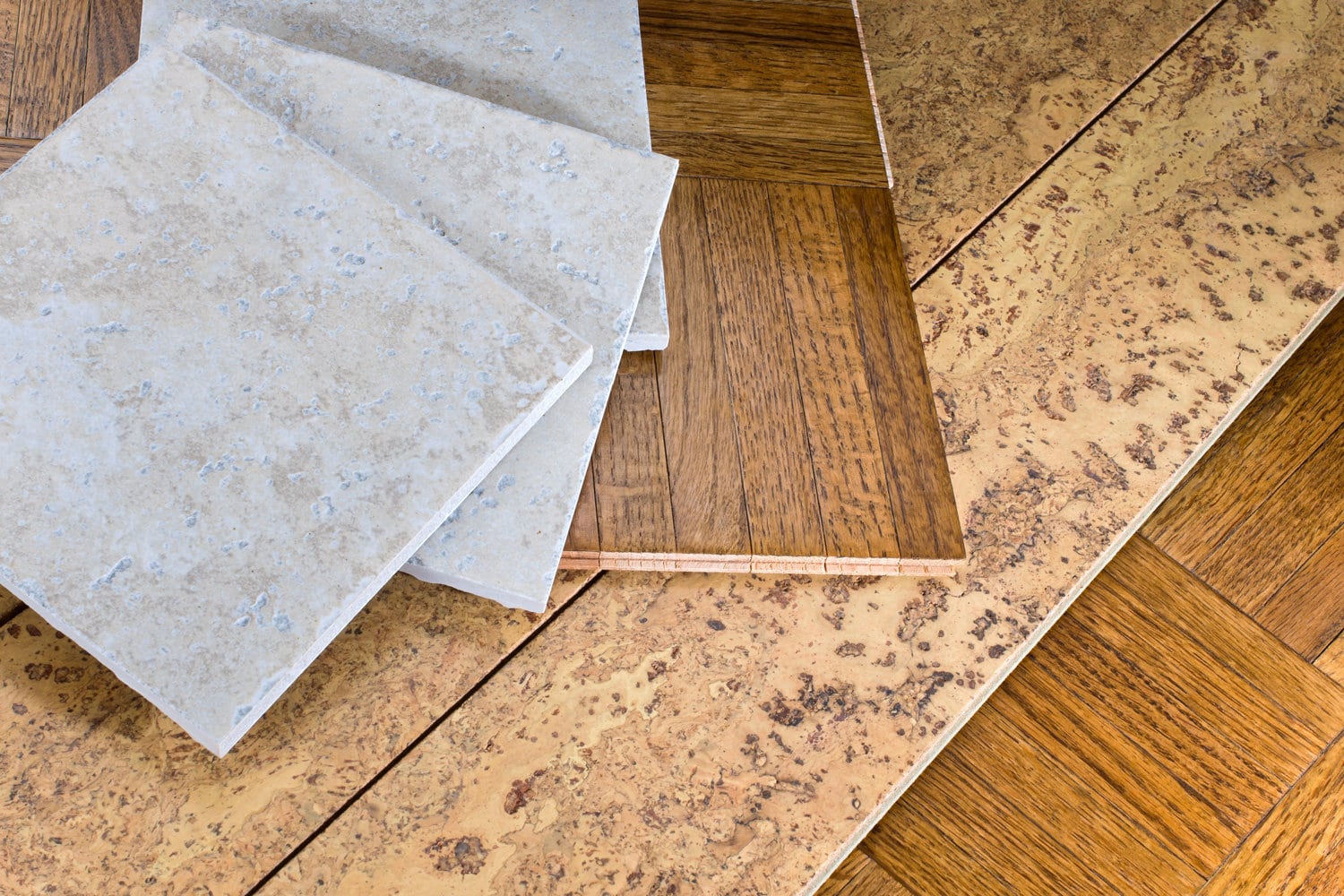 ceramic tile, cork and parquet wooden flooring samples for home interior remodel 
