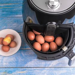 cook eggs easily air fryer bluea painted wooden surface table, Will Eggs Explode In An Air Fryer?