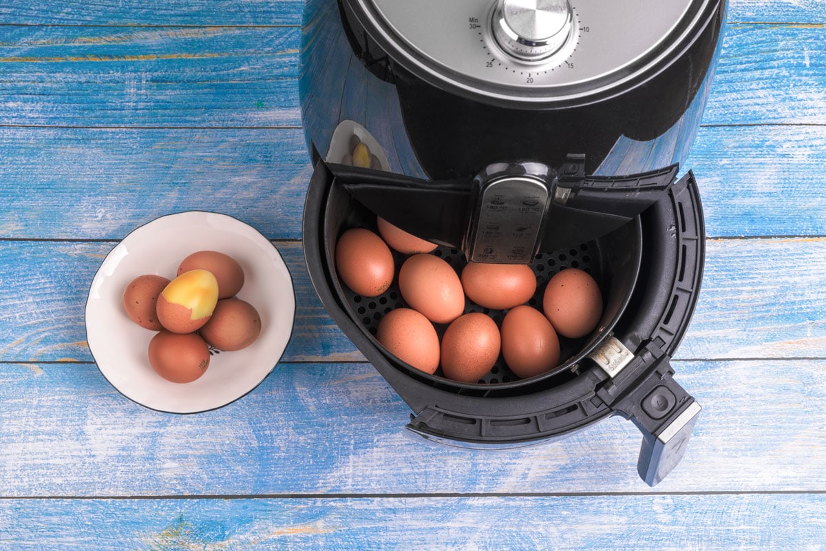 cook eggs easily air fryer blue painted wooden surface table