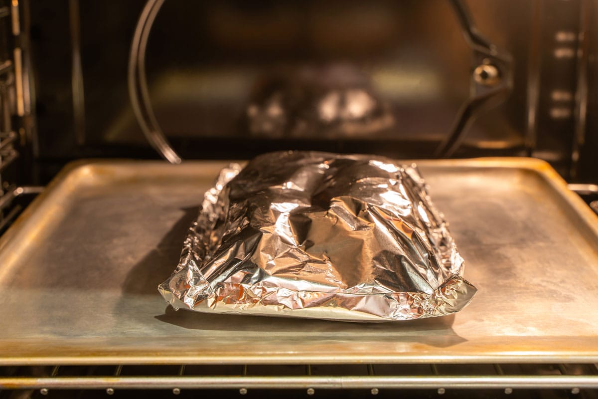 food covered foil on pan inside