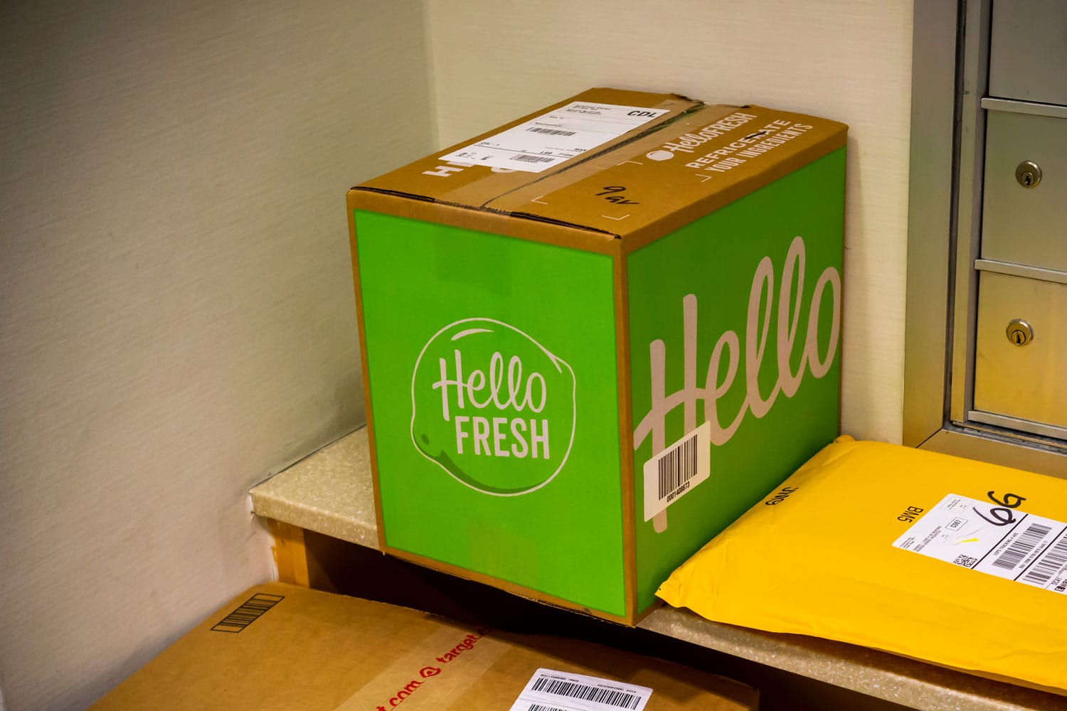 A delivery from the Hello Fresh meal subscription service waits to be picked up in the lobby of an apartment building