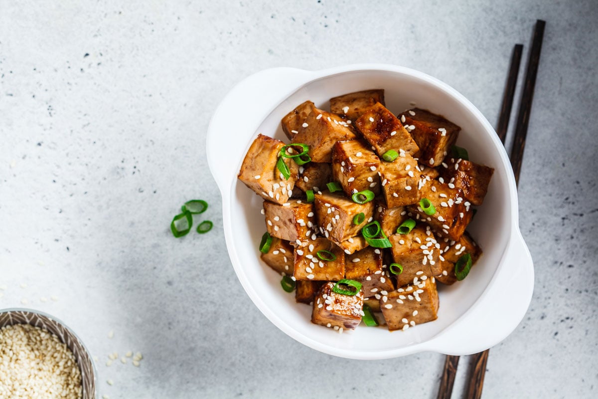 Big chunks of tofu drizzled with honey soy glaze and sesame seeds