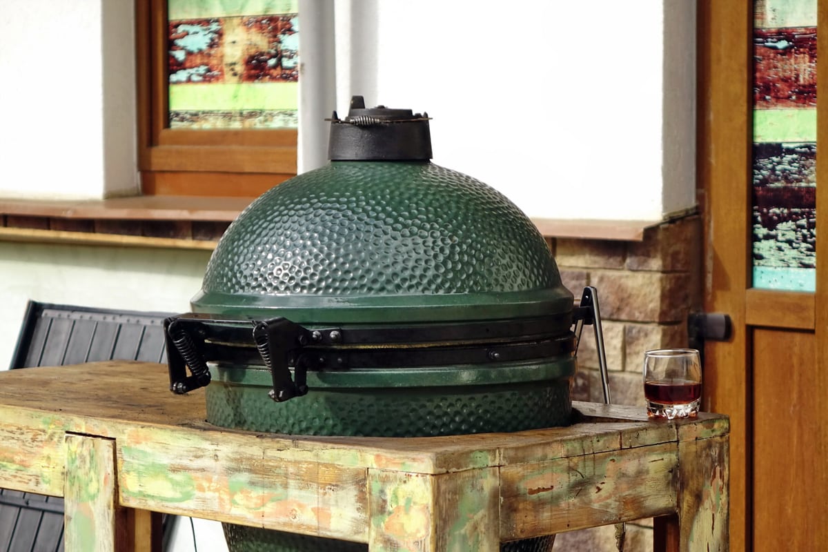 Closeup Of Green Ceramic BBQ Grill Mounted In The Table Referred To As A Kamado Or Mushikamado, Japanes Cooker