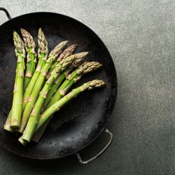 Fresh of green Asparagus. Cooking healthy meal in pan. Bunches of green asparagus, - How To Cook Canned Asparagus [5 Ways You Will Love!]