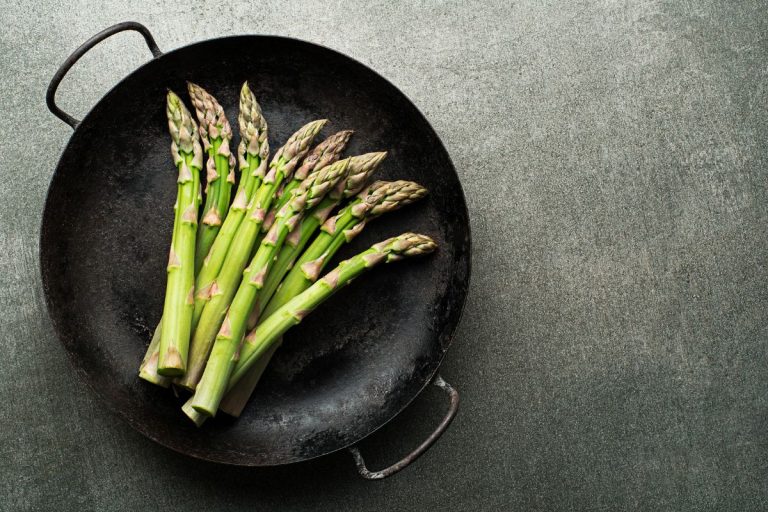 Fresh of green Asparagus. Cooking healthy meal in pan. Bunches of green asparagus, - How To Cook Canned Asparagus [5 Ways You Will Love!]