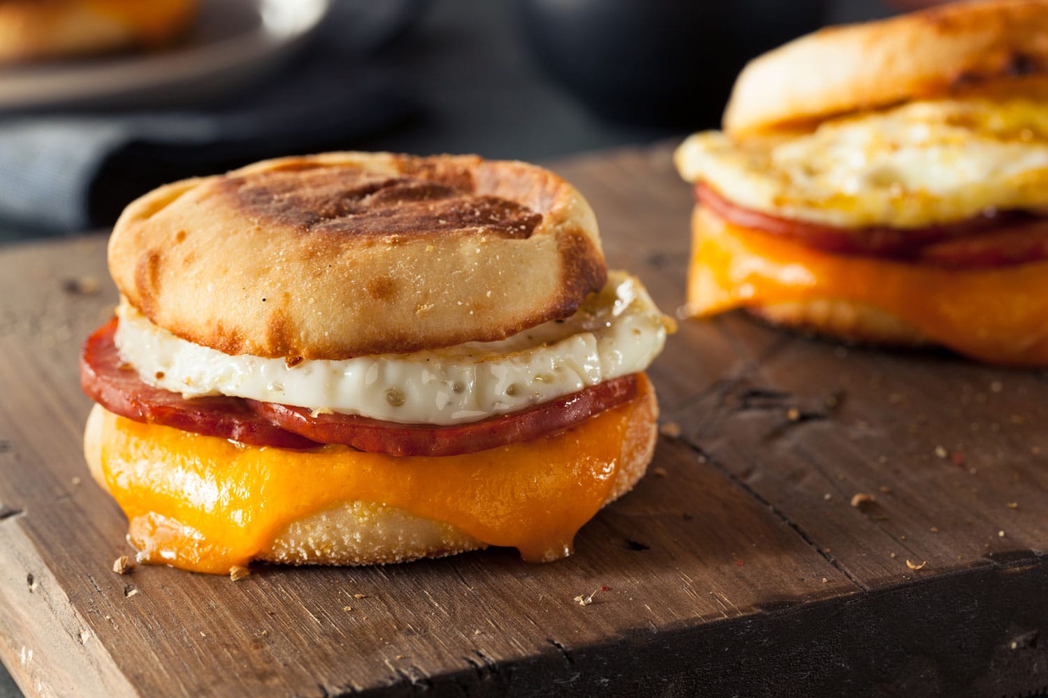Homemade Breakfast Egg Sandwich with Cheese on an English Muffin 