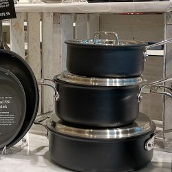 Nonstick All Clad pot and pan on display at the store, Do All-Clad Handles Get Hot? Can You Touch Them While Cooking?