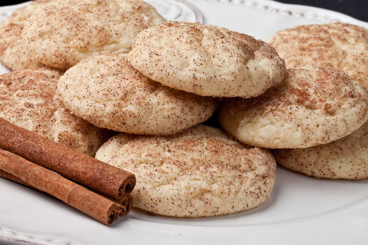 Platter of fresh from the oven cinnamon sugar Snickerdoodle cookies on a vintage plate 