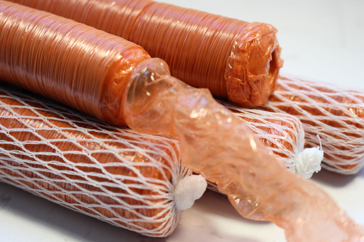 Polyamide shell for meat sausages. Synthetic orange casing