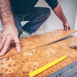 Professional removing the cork flooring panels, How To Remove Cork Flooring From Concrete [Quickly & Easily]