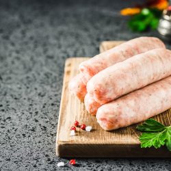 Raw sausages with herbs, spices, herbs on dark background. , Is there a substitute for Italian sausage?