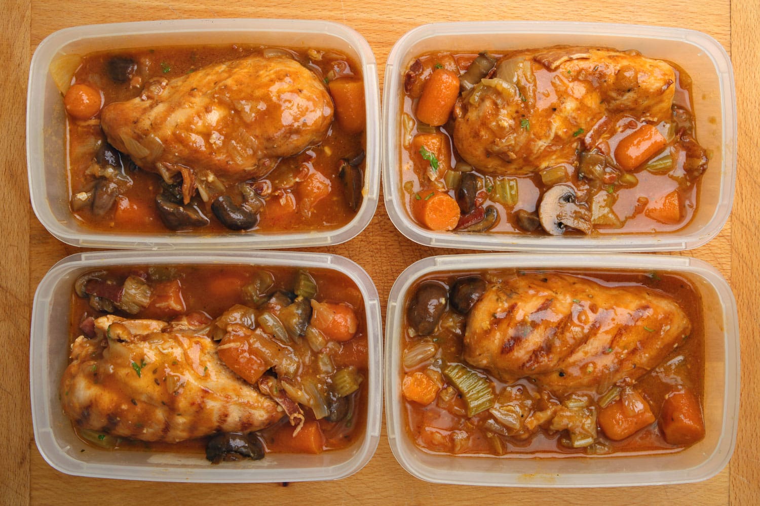 Slow-cooked chicken dinner portions being prepared for freezing or chilling. 