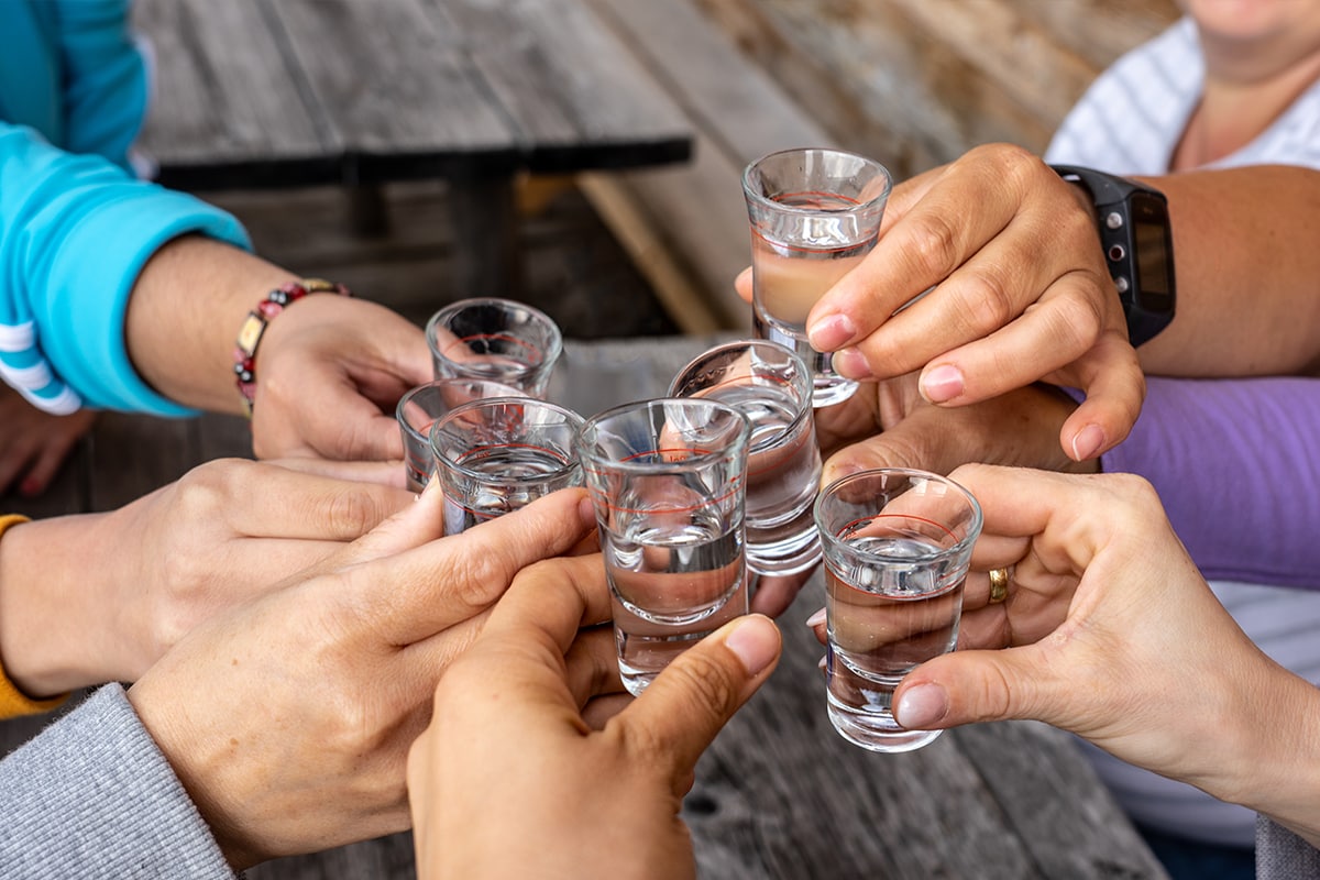 Toast with friends with spirits shots