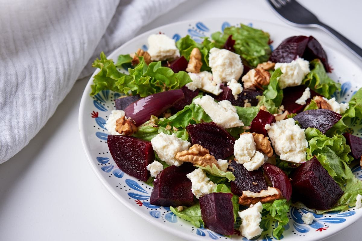 plate of beetroot, soft cheese and walnuts