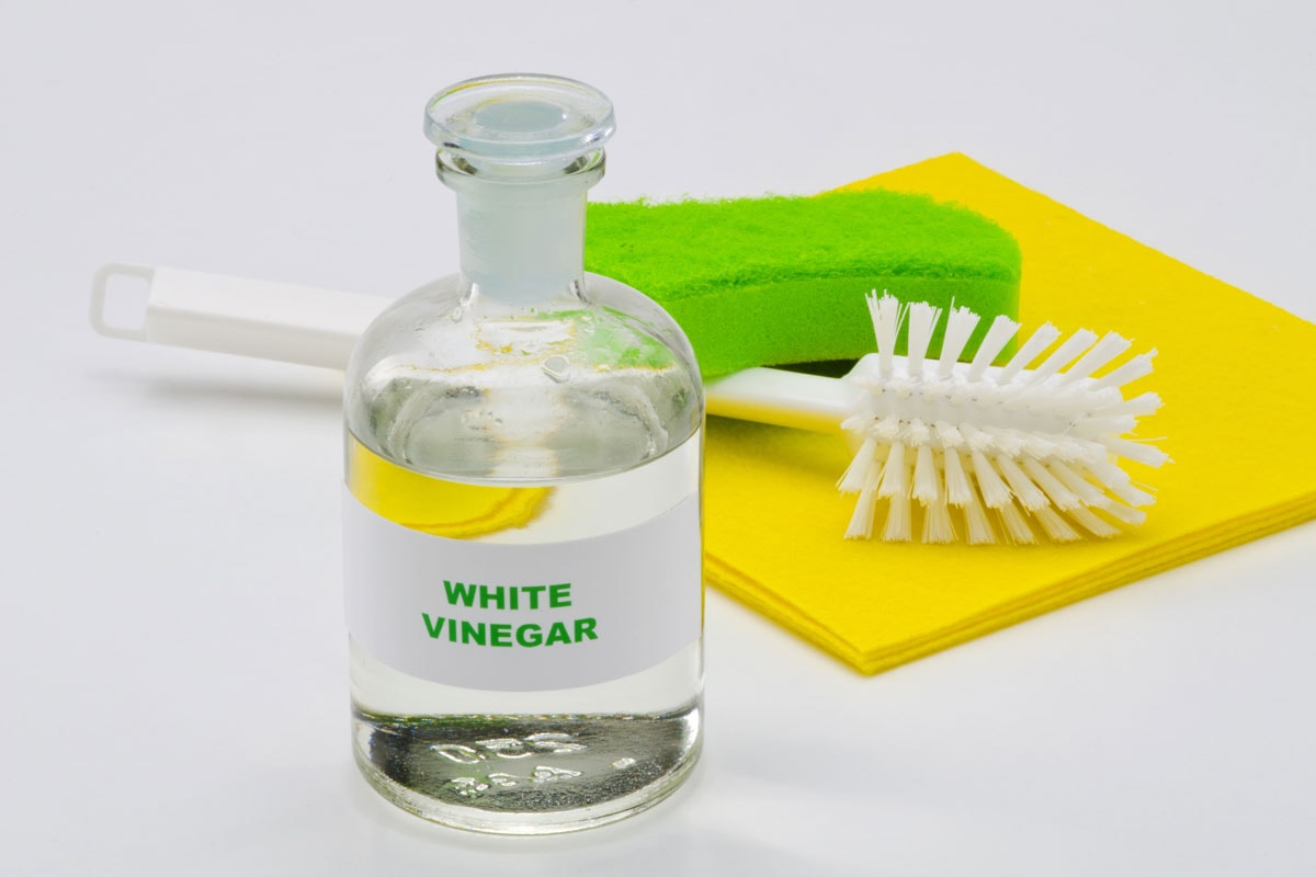 white vinegar glass bottle background organic