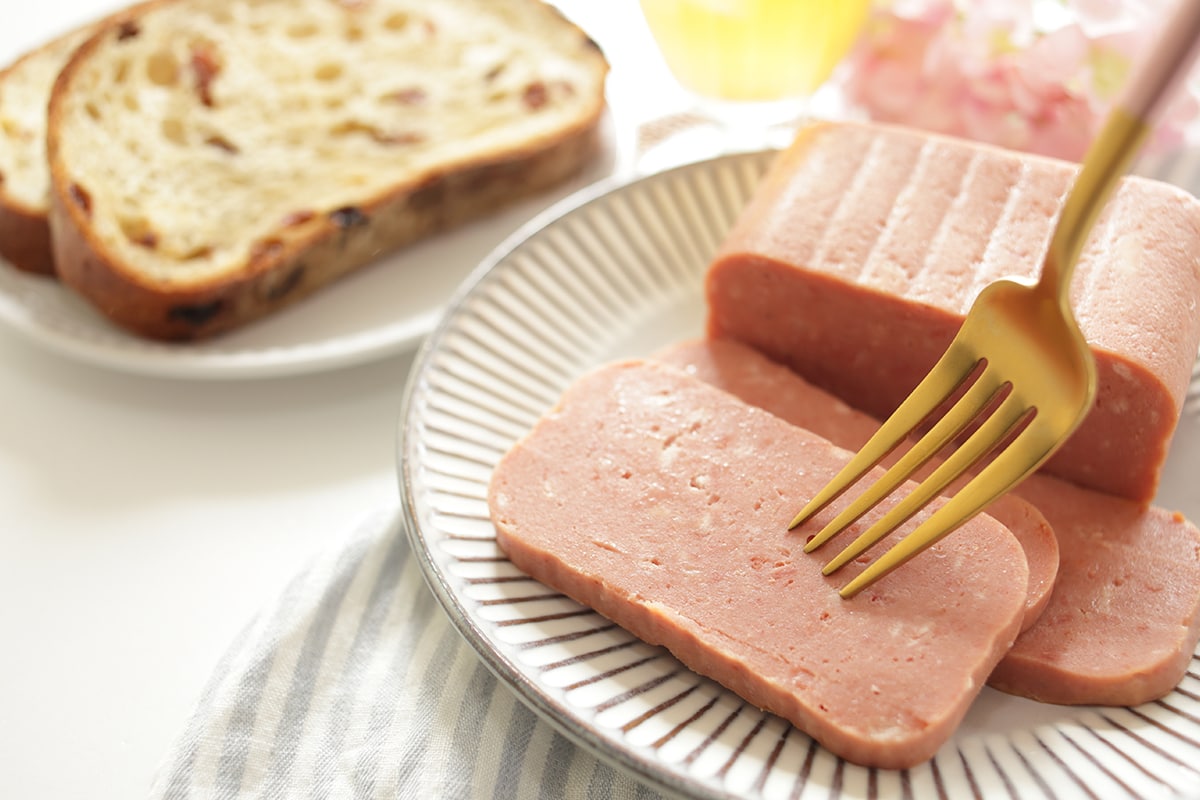 Luncheon meat sliced on dish