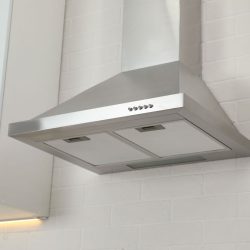 Modern range hood on white brick wall in kitchen, Why Does My Oven Have A Hole In The Top?