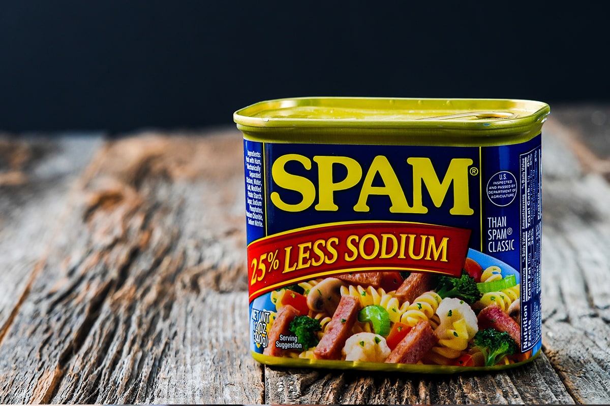 Spam ham can with less sodium on rustic boards