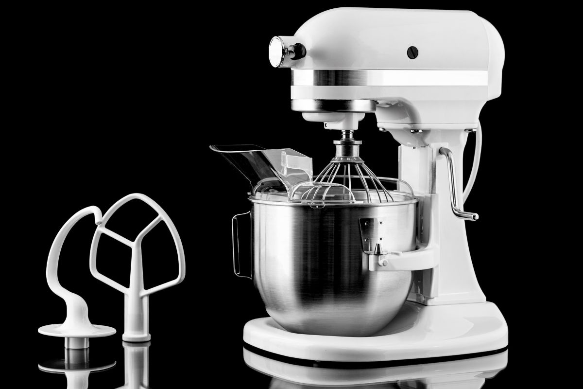 White kitchen mixer isolated on a black background