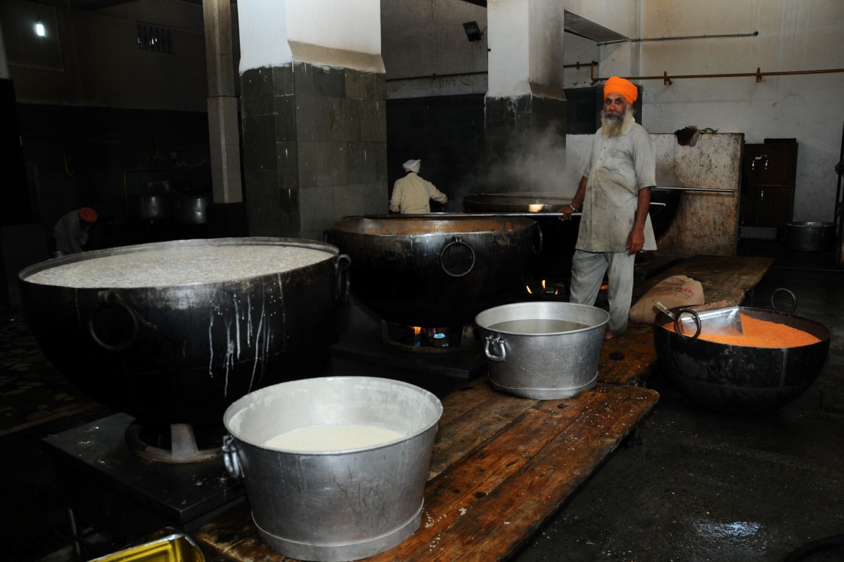 Amritsar, Punjab, India-Sep 13 2009 large container of kheer (indian Rice Pudding) kept at community kitchen of the Golden Temple's Langer (Kitchen) serves as free meals.
