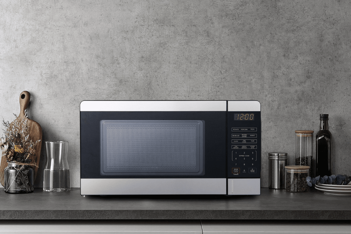 Modern black microwave oven on kitchen countertop.