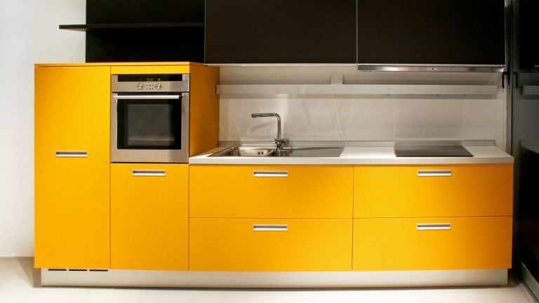 Yellow kitchen cabinets in a modern kitchen, How To Tone Down Yellow Cabinets - 1600x900