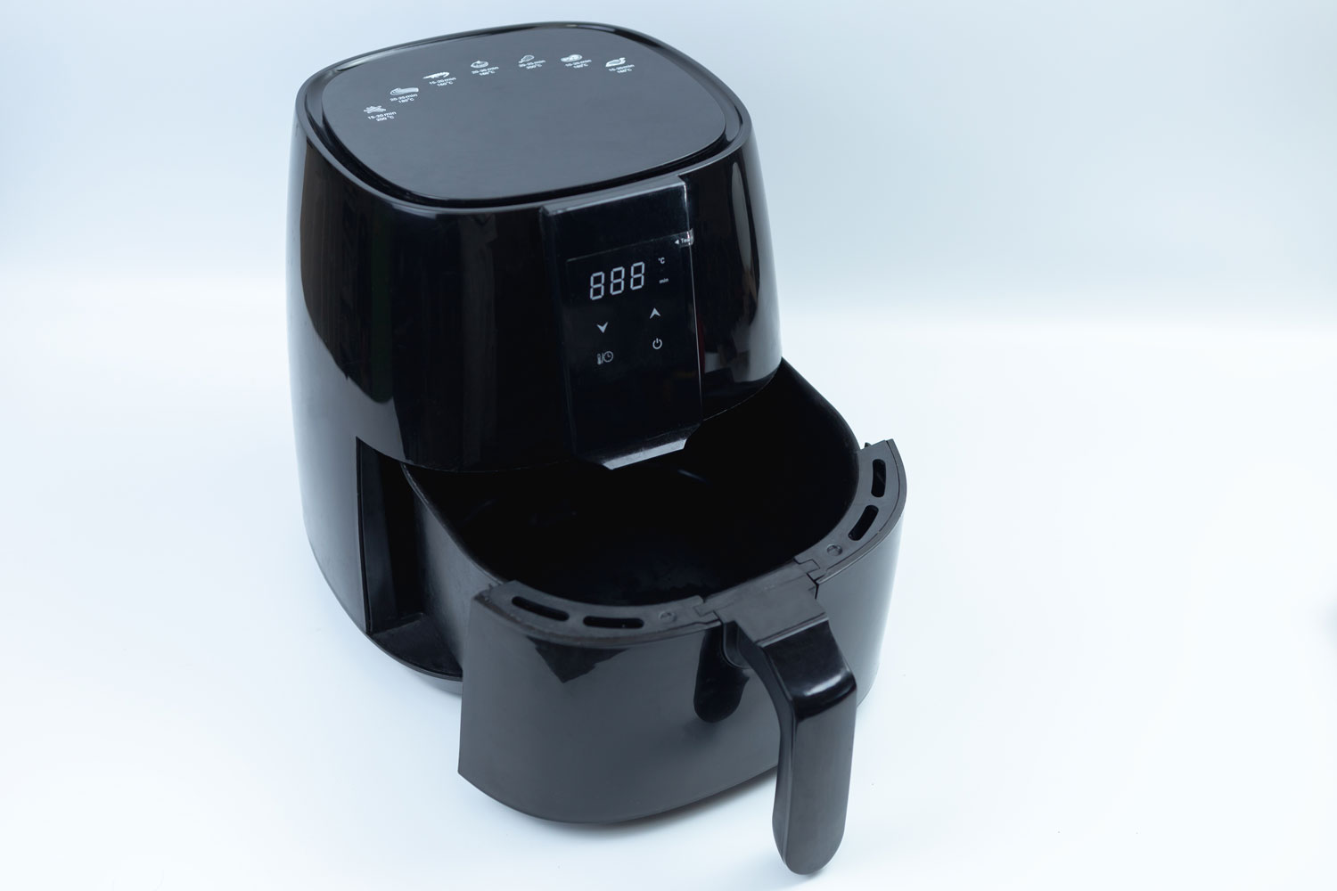 Black air fryer on a white background