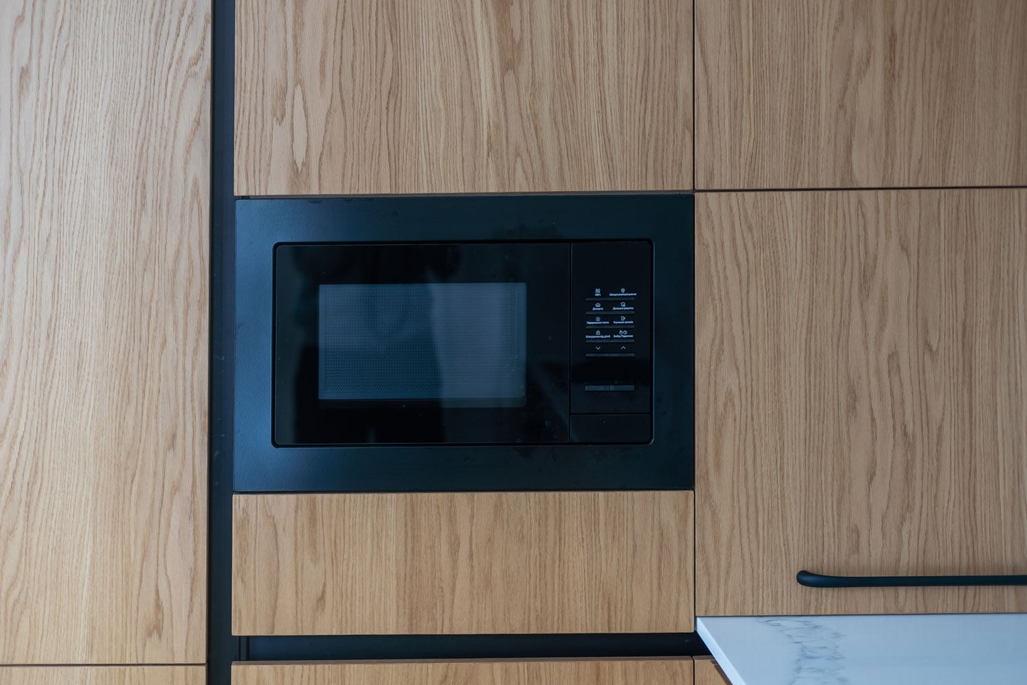 A built-in microwave in the kitchen