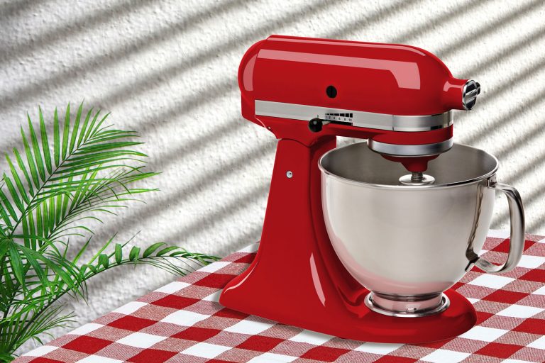 Red stand or kitchen mixer on table, How Often To Change Grease In Your KitchenAid Mixer [& What Is The Best Grease To Use]?