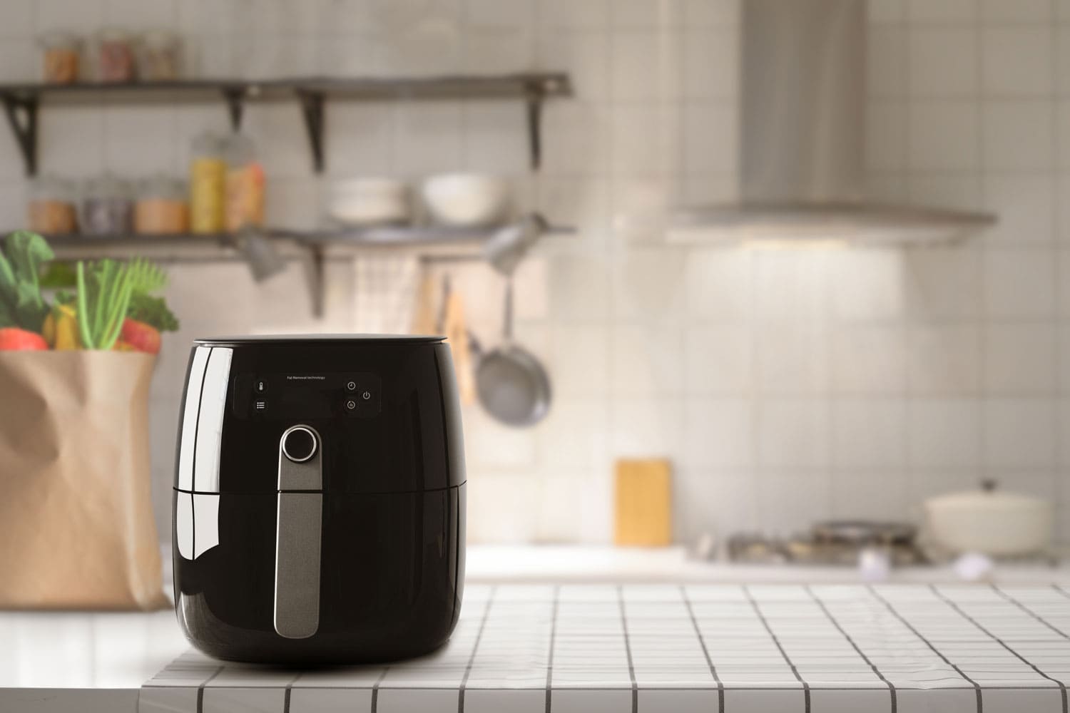 A black air fryer placed on the table