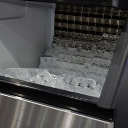 A modern ice machine used in a big kitchen, How To Reset A Hoshizaki Ice Maker [Quickly & Easily] - 1600x900