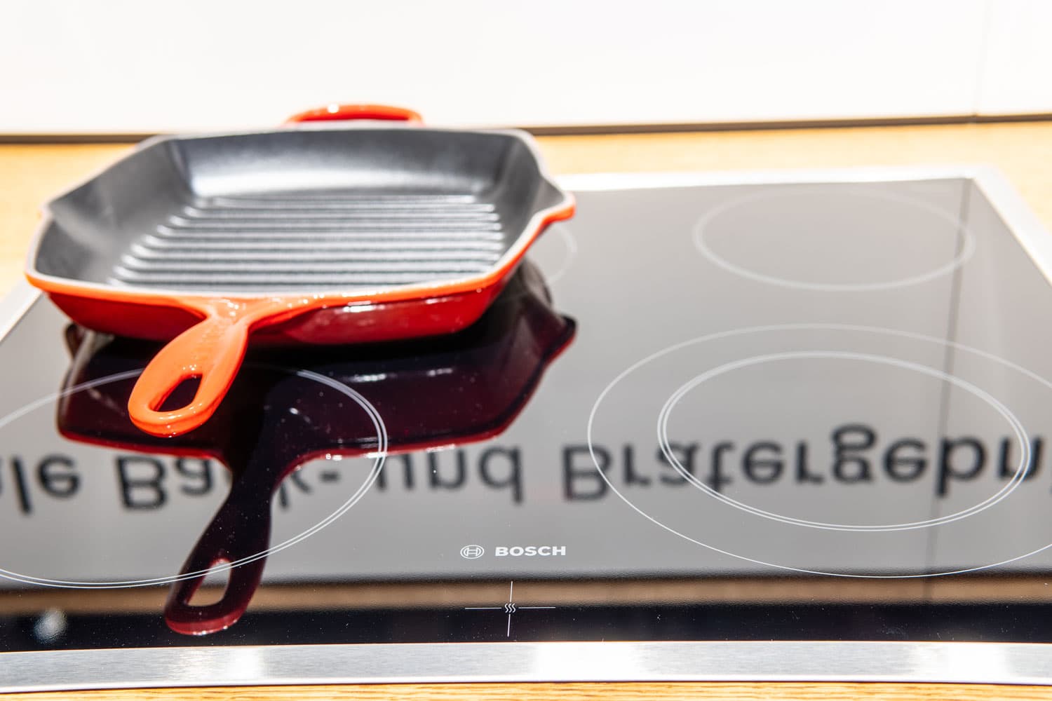 A non stick skillet placed on top of a bosch induction cooker