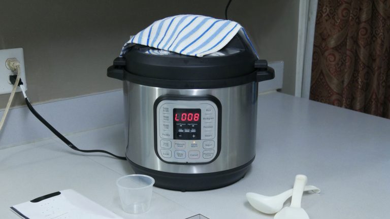 An instant pot in the kitchen, How To Use The Bake Function On An Instant Pot [Step By Step Guide] - 1600x900