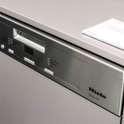 A brand new Miele dishwasher, How To Reset A Miele Dishwasher [Quickly & Easily] - 1600x900