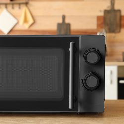 A black colored microwave in the kitchen, How To Set The Clock On A Sunbeam Microwave - 1600x900