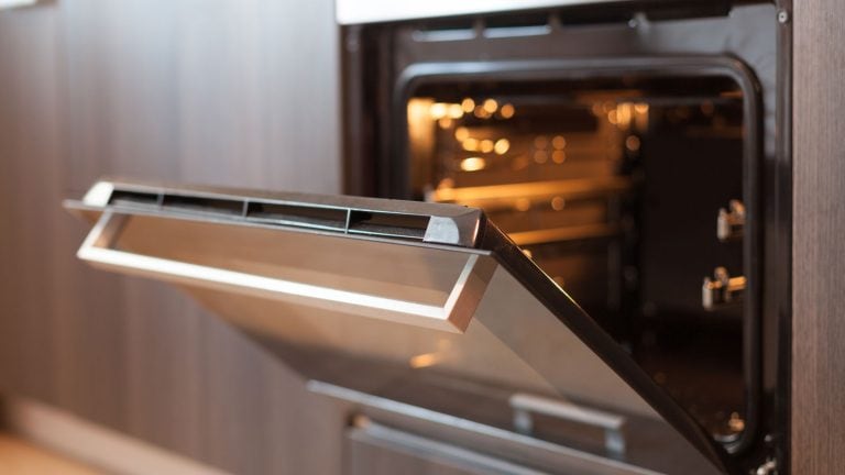 An opened oven in the kitchen, Frigidaire Oven Door Won’T Go Back On - How To Put It Back [Step By Step Guide] - 1600x900